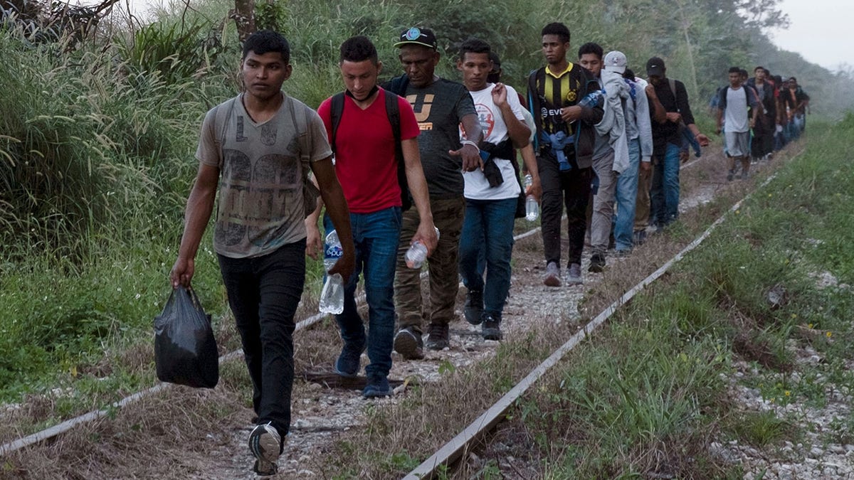 Migrants journey from Central America to the U.S. border last month. (AP Photo/Isabel Mateos, File)