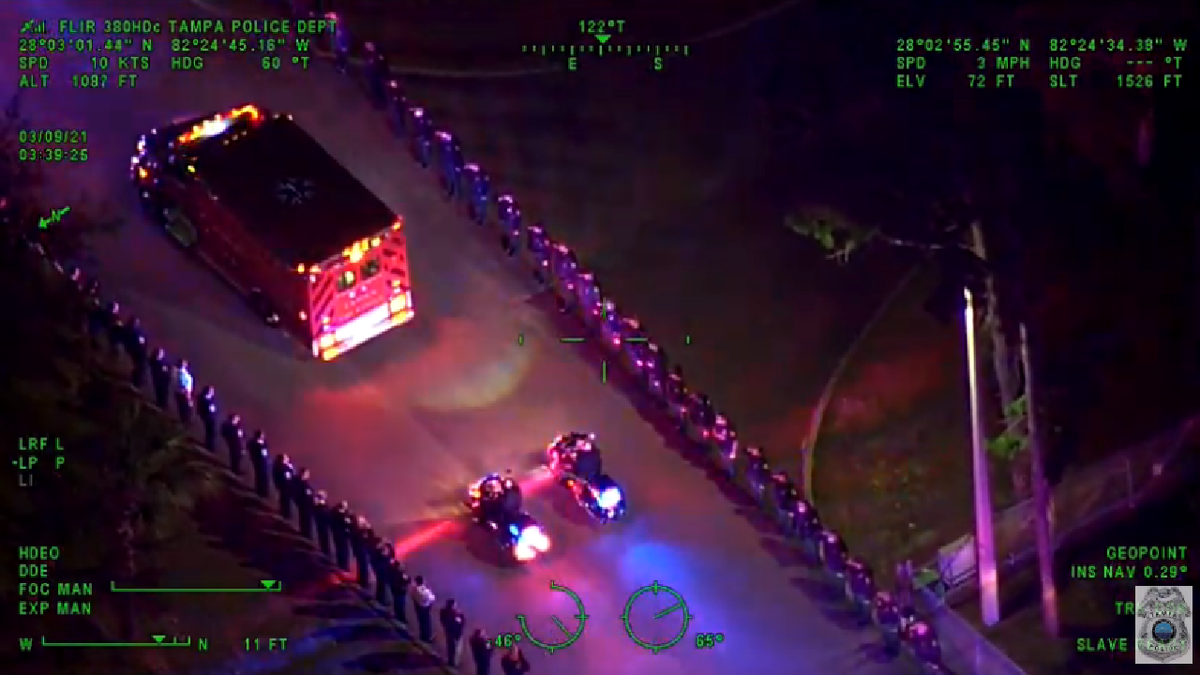 Officer Madsen receiving a police escort away from the crash scene earlier this morning. (Tampa Police Department)