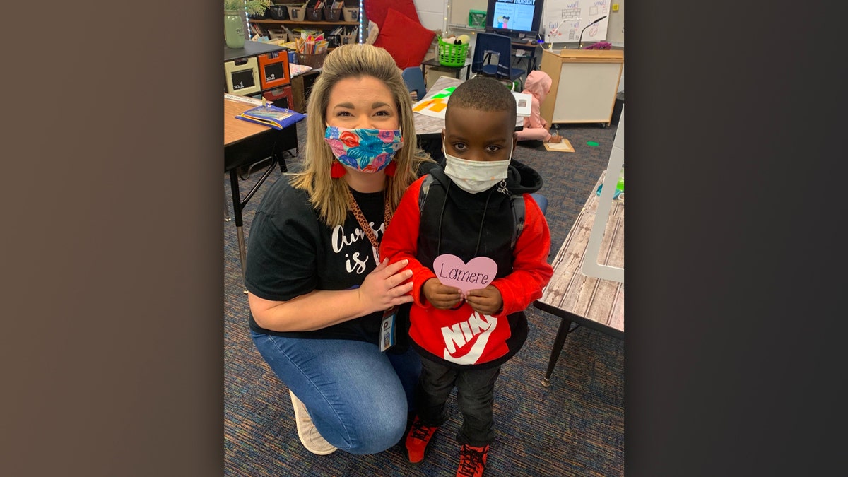 Paraprofessional at Johnston Elementary School, Makinzie Corley, and 7-year-old Lamere Johnson