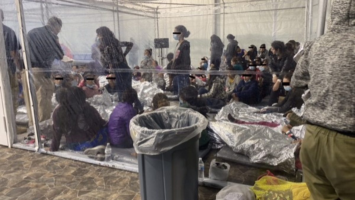 Photo of migrants in a Customs and Border Protection temporary overflow facility in Donna, Texas, being held in clear pens akin to cages. (Office of Rep. Henry Cuellar, D-Texas)