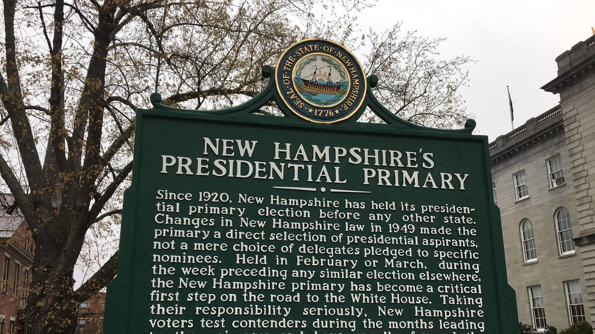 A sign next to New Hampshire's state capitol in Concord, NH, marks the state's century-old tradition of holding the nation's first presidential primary