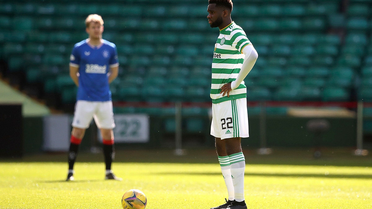 Celtic's Odsonne Edouard stands instead of taking a knee prior to the Scottish Premiership soccer match at Celtic Park, Glasgow, Sunday March 21, 2021. (Andrew Milligan/PA via AP)