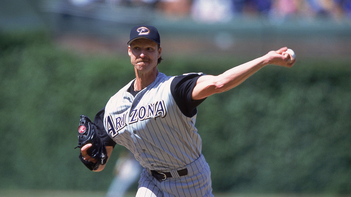 Randy Johnson is now a sideline photographer with an incredible dead bird  logo 