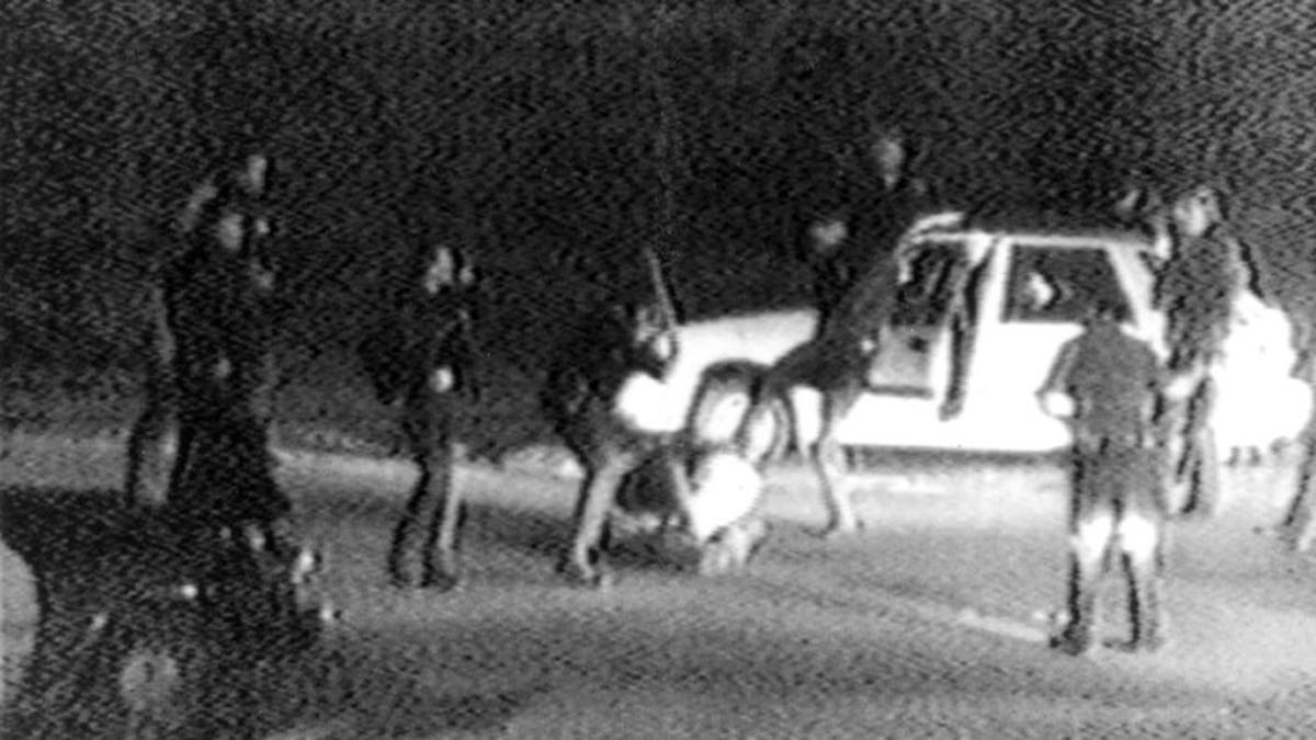 A grainy shot from the 1991 video taken by?George Holliday of the police beating of Rodney King.?