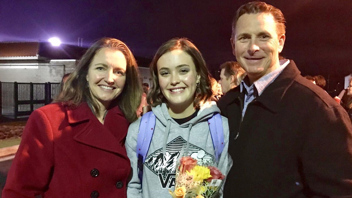 From left to right, Sarah Moreta, her 17-year-old daughter, and her husband. 