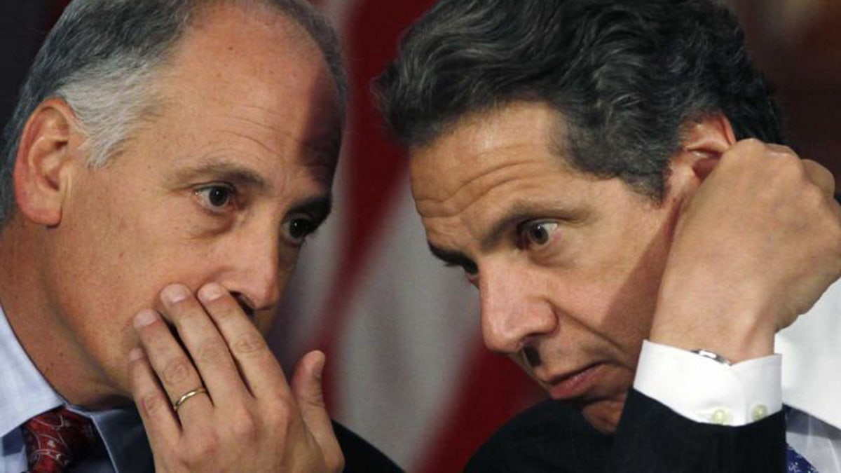 Gov. Andrew Cuomo and long-time friend Larry Schwartz (Source: AP)