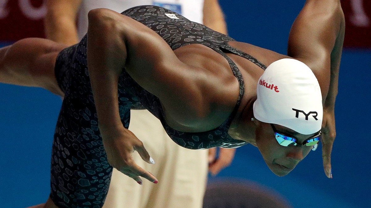 FILE - In this July 27, 2019, file photo, United States' Simone Manuel starts a heat of the women's 50-meter fresstyle at the World Swimming Championships in Gwangju, South Korea. Manuel joined with fellow Olympians Sue Bird, Chloe Kim and Alex Morgan to launch TOGETHXR, a media and commerce company aimed at girls and women. It will create content for social media platforms like Instagram and TikTok as well as its own YouTube channel. Billie Jean King cheered its announcement this week. "I can’t wait to share everything we have in store," Manuel tweeted earlier this week. " (AP Photo/Mark Schiefelbein, File)