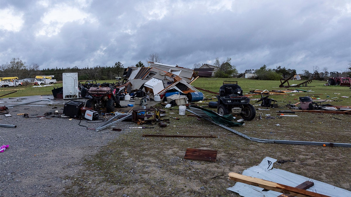 Debris litters weather-damaged properties at the intersection of County Road 24 and 37 in Clanton, Ala., the morning following a large outbreak of severe storms across the southeast, Thursday, March 18, 2021.