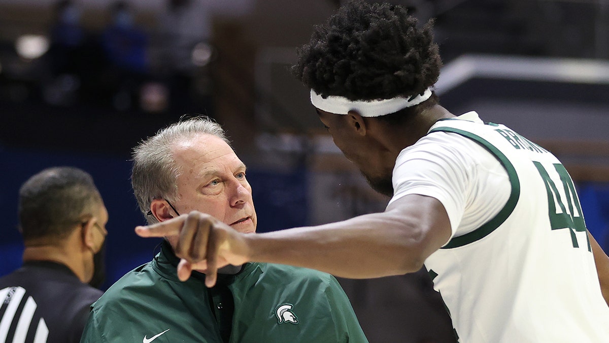 Head coach Tom Izzo of the Michigan State Spartans talks with Gabe Brown at Mackey Arena on March 18, 2021 in West Lafayette, Indiana. 