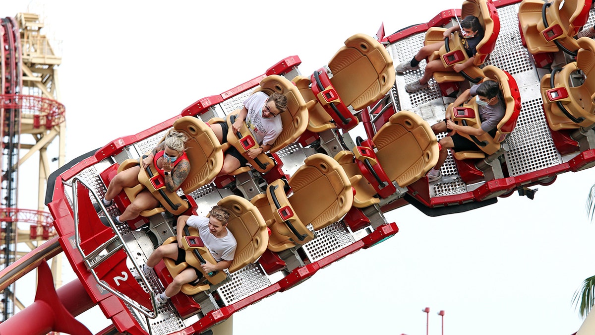 The California Amusement Park Association is requiring its members to modify seating on rides in order to "mitigate the effect of shouting." Parks in other parts of the country, such as Universal Studios Orlando, are already enforcing physical-distancing requirements between groups or parties on rides. (Gregg Newton/AFP via Getty Images)
