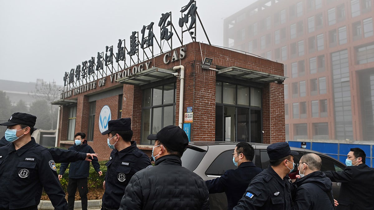 Members of the World Health Organization (WHO) team investigating the origins of the COVID-19 coronavirus arrive at the Wuhan Institute of Virology in Wuhan in China's central Hubei province on Feb. 3, 2021. 