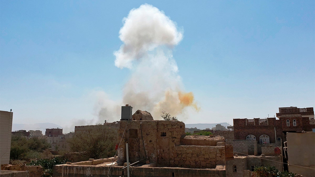 The smoke rises after the air attacks led by Saudi at an army base in Sana'a, Yemen, on March 7, 2021.