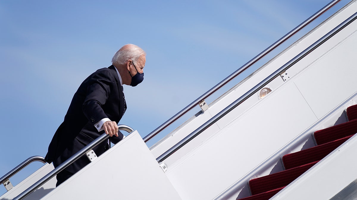 President Joe Biden recovers after stumbling while boarding Air Force One at Joint Base Andrews in Maryland on March 19, 2021. (AP Photo/Patrick Semansky)