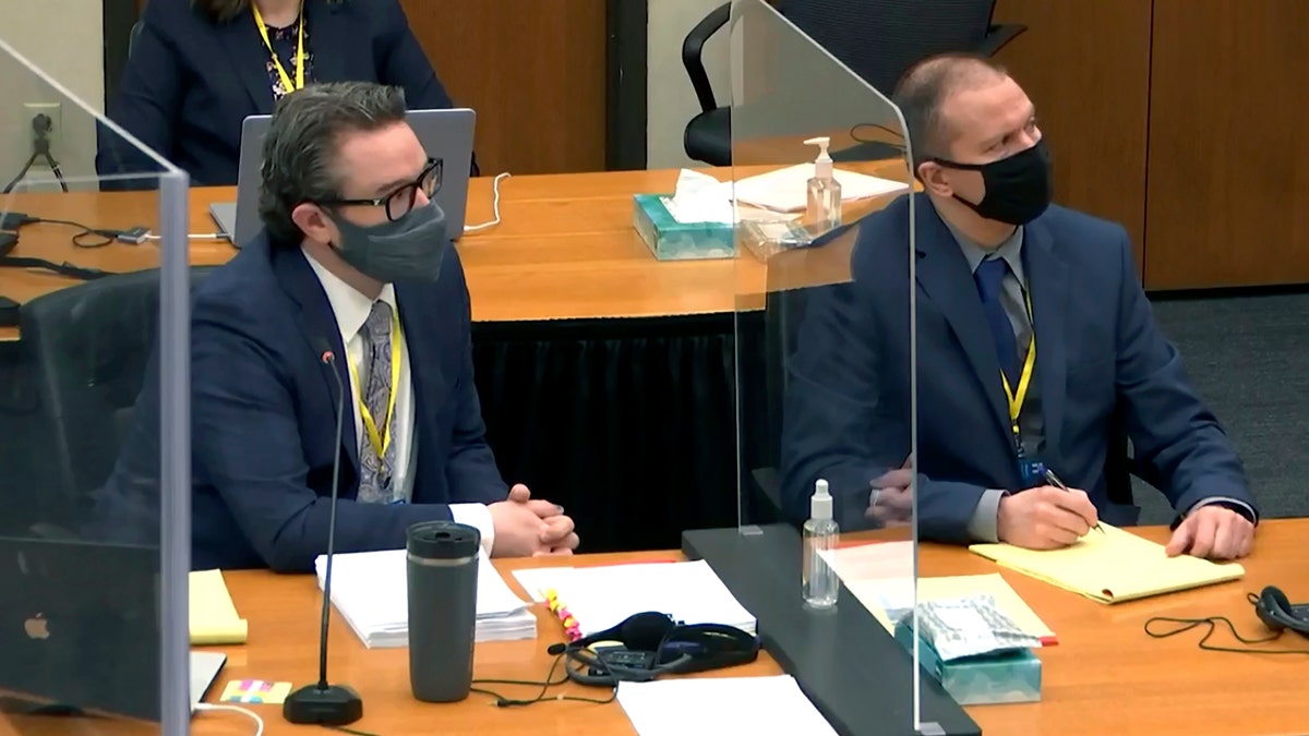 In this image taken from video, defense attorney Eric Nelson, left, and defendant, former Minneapolis police officer Derek Chauvin, right, listen to Hennepin County Judge Peter Cahill during pretrial motions prior to continuing jury selection in the trial of Chauvin, Thursday, March 11, 2021, at the Hennepin County Courthouse in Minneapolis, Minn. Chauvin is accused in the May 25, 2020, death of George Floyd. (Court TV/Pool via Pool)