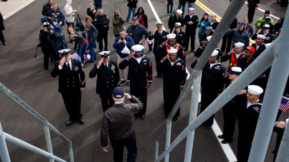 Vice President Joe Biden salutes as he leaves the USS Gettysburg after welcoming home sailors at Mayport Naval Base, Fla, Dec. 8, 2011. (Official White House Photo by David Lienemann)