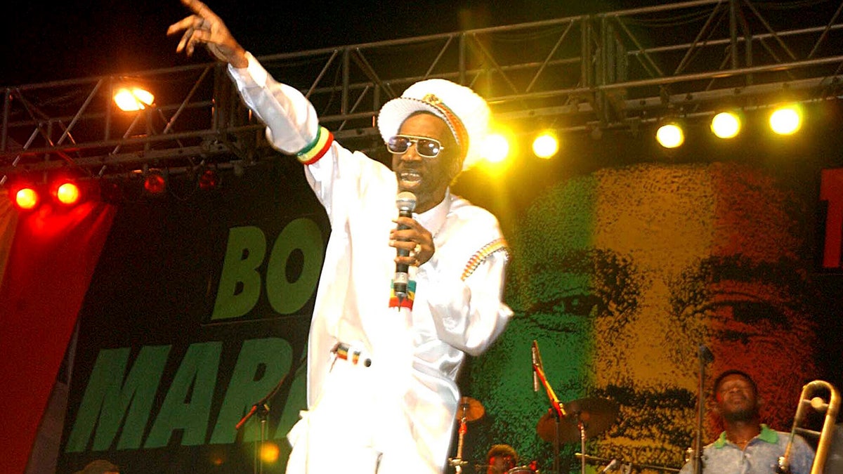 In this Feb. 6, 2005 file photo, Bunny Wailer performs at the One Love concert to celebrate Bob Marley's 60th birthday, in Kingston, Jamaica. 