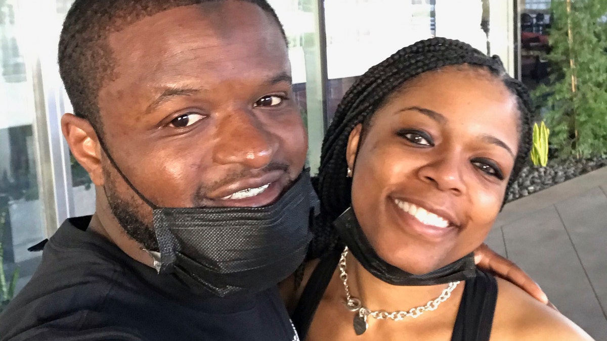 In this undated photo provided by Donald Outlaw and his wife Monique Solomon-Outlaw, the couple poses for a photograph. Donald Outlaw, who was exonerated after spending over 15 years in prison for murder, filed a federal lawsuit Wednesday, March 17, 2021, against the city of Philadelphia and two homicide detectives for wrongful prosecution and incarceration. (Donald Outlaw & Monique Solomon-Outlaw via AP)