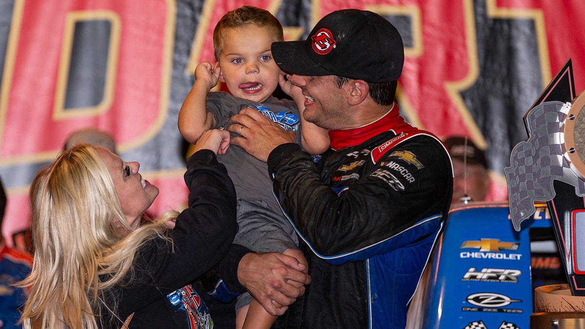 Stewart and Jessica celebrated Stewart's win at Eldora Speedway in 2019 with their son Parker.