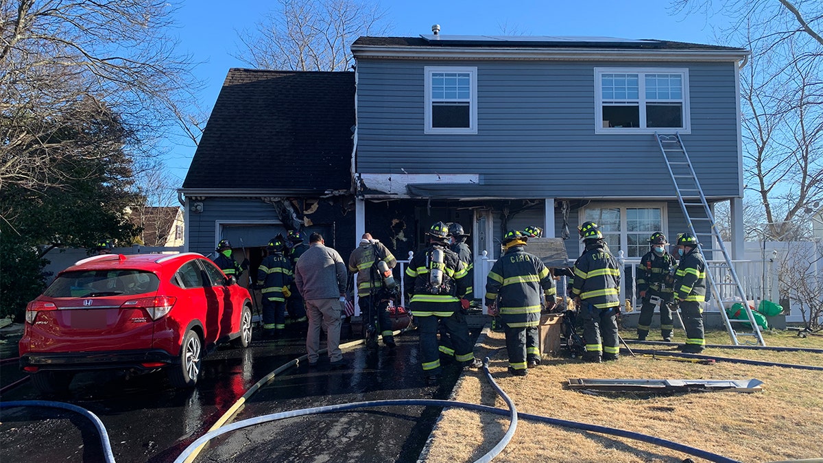Central Islip firefighters extinguished the flames at the house on Oak Street.