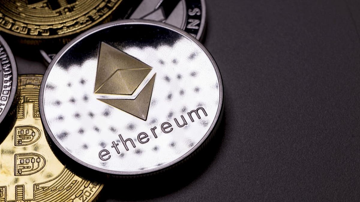izmir, Turkey - January 12, 2018 Close up ethereum coin with other crypto coins shot in black background in studio (iStock)