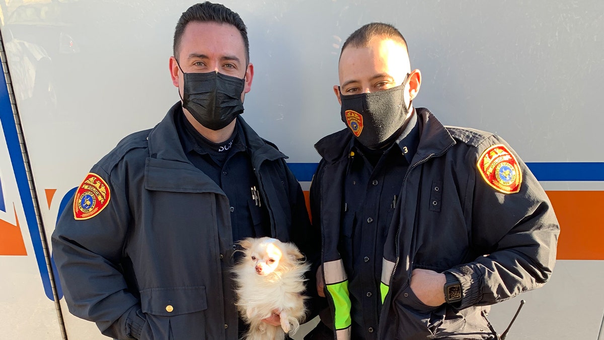 Officer Rivera is on the left holding the Chihuahua, JJ. Officer Galanos is on the right.