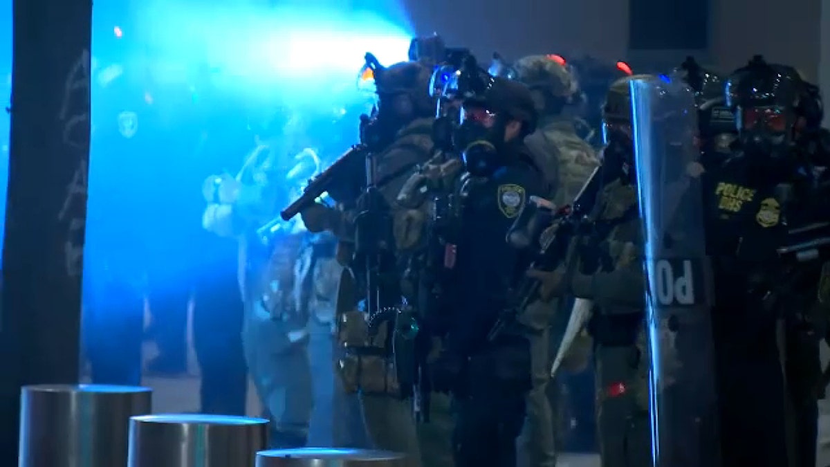 Law enforcement officers deployed in Portland, Oregon, on Thursday night. (FOX 12 Oregon)