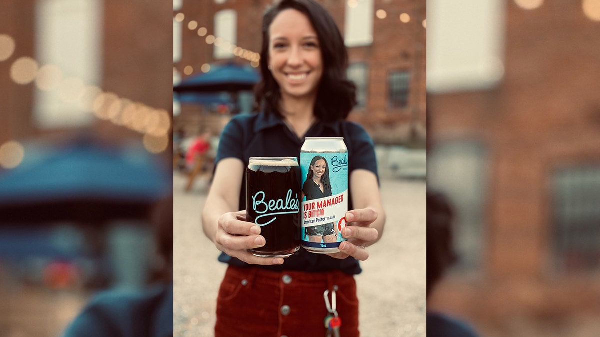 The front of each can is printed with a smiling photo of general manager Brittany Canterbury.