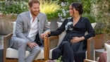 This image provided by Harpo Productions shows Prince Harry, left, and Meghan, Duchess of Sussex, speaking about expecting their second child during an interview with Oprah Winfrey. "Oprah with Meghan and Harry: A CBS Primetime Special" airs March 7 as a two-hour exclusive primetime special on the CBS Television Network. (Joe Pugliese/Harpo Productions via AP)