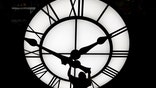 Electric Time technician Dan LaMoore puts a clock hand onto a 1000-lb., 12-foot diameter clock constructed for a resort in Vietnam, Tuesday, March 9, 2021, in Medfield, Mass. Daylight saving time begins at 2 a.m. local time Sunday, March 14, 2021, when clocks are set ahead one hour.