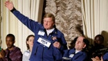 FILE - In this April 13, 2018, file photo, Dick Hoyt, left, and his son Rick, who competed together in 32 Boston Marathons, are introduced at a news conference in Boston before the 122nd running of the Boston Marathon in Boston. Dick Hoyt, who last competed with his son in the Boston Marathon in 2014, has died, the Boston Athletic Association announced Wednesday, March 17, 2021. He was 80.  (AP Photo/Elise Amendola, File)