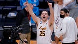 Loyola Chicago center Cameron Krutwig (25) celebrates after defeating Georgia Tech 71-60 in a first-round game in the NCAA men's college basketball tournament at Hinkle Fieldhouse, Indianapolis, Friday, March 19, 2021. (AP Photo/AJ Mast)