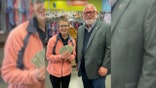 Frank Holland, the Goodwill VP of Donated Goods, presented Lessing with the cash reward.