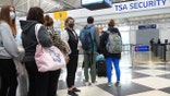 CHICAGO, ILLINOIS - MARCH 16: Travelers arrive for flights at O'Hare international Airport on March 16, 2021 in Chicago, Illinois. On March 12, the TSA screened more than 1.3 million travelers, the highest number since the start of the pandemic. (Photo by Scott Olson/Getty Images)