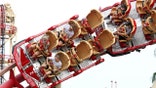 Visitors ride a roller coaster at Universal Studios theme park on the first day of reopening from the coronavirus pandemic, on June 5, 2020, in Orlando, Florida. (Photo by Gregg Newton / AFP) (Photo by GREGG NEWTON/AFP via Getty Images)