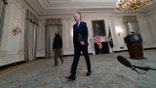 President Joe Biden, accompanied by Vice President Kamala Harris, departs after speaking in the State Dining Room of the White House, Saturday, March 6, 2021, in Washington. (AP Photo/Alex Brandon)
