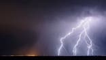 Lightning bolts strike from a thunderstorm.