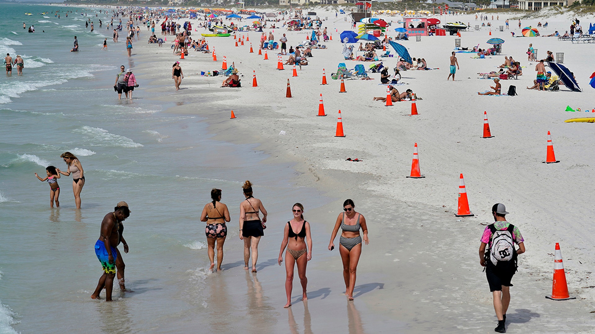 Beachgoers take advantage of the weather as they spend time on Clearwater Beach, Florida, March 2, 2021, a popular spring break destination, west of Tampa. Colleges around the U.S. are scaling back spring break or canceling it to discourage beachfront partying that could raise infection rates back on campus. (AP Photo/Chris O'Meara)