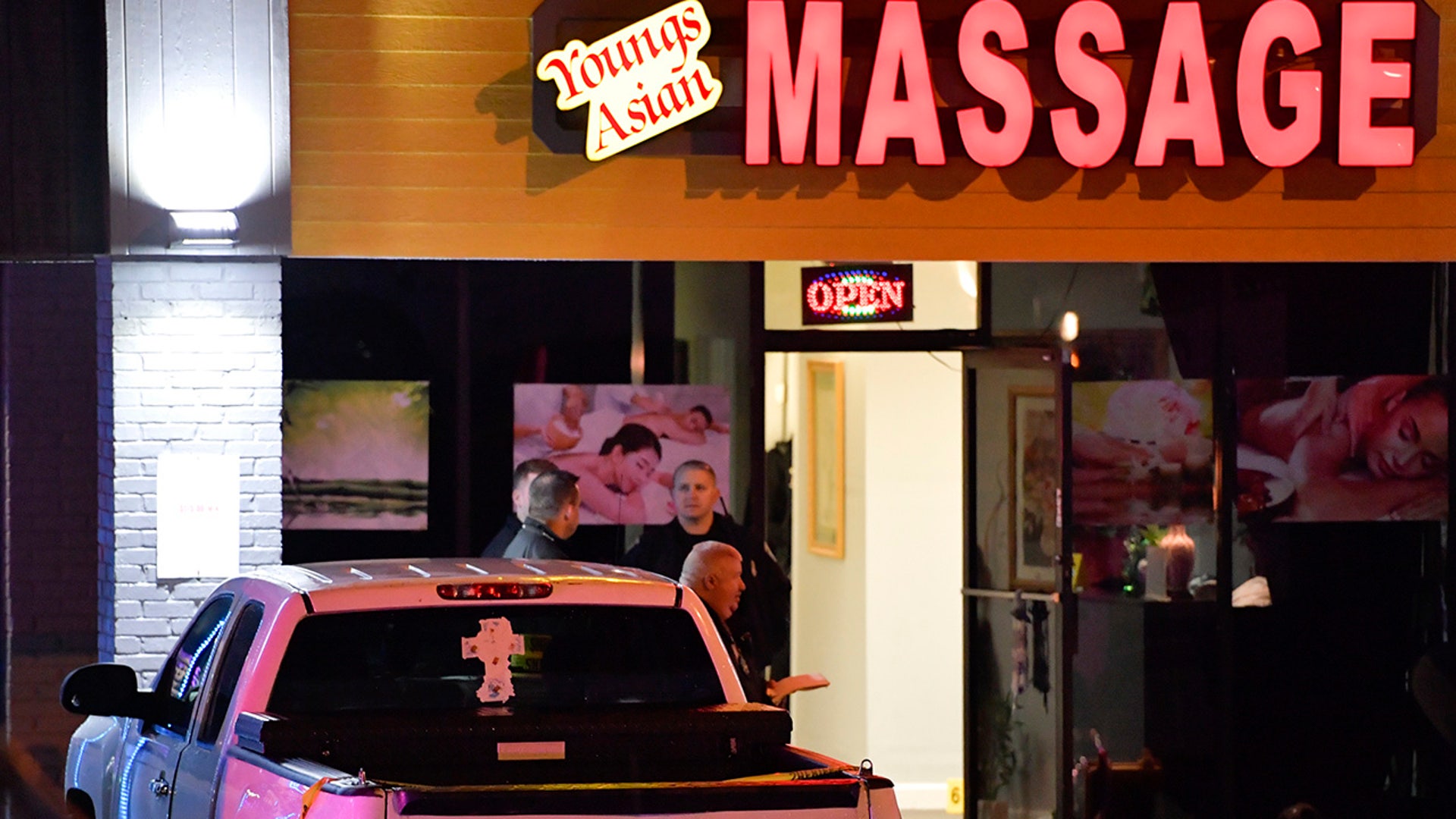 Authorities investigate a fatal shooting at a massage parlor late Tuesday, March 16, 2021, in Acworth, Ga. Officials say 21-year-old Robert Aaron Long, of Woodstock, Ga., has been captured hours after multiple people were killed in shootings at three Atlanta-area massage parlors. (AP Photo/Mike Stewart)