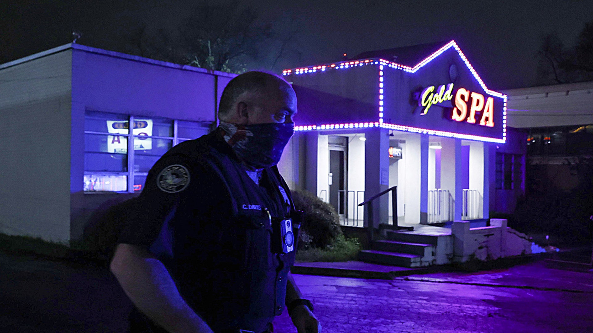 City of Atlanta Police Officer Davis works at the scene outside of Gold Spa after deadly shootings at a massage parlor and two day spas in the Atlanta area, in Atlanta, Ga., March 16, 2021. (REUTERS/Chris Aluka Berry)
