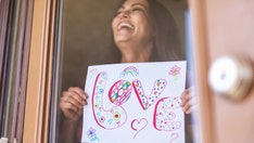 Woman flirts with neighbor with signs through window, TikTok begs to know what happens next