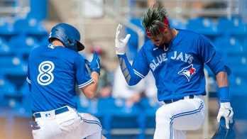 Twins newcomer Happ back on mound after positive virus test