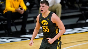 Garza gets 21 points, No. 5 Iowa tops No. 25 Wisconsin 77-73