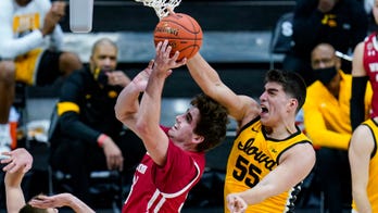Garza leads No. 5 Iowa past Wisconsin in Big Ten tourney