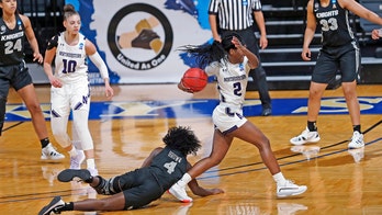 Northwestern women beat UCF 62-51, 1st tourney win since '93