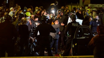 Echo Park protest in LA declared unlawful assembly; police say 'high-intensity lights' used against officers