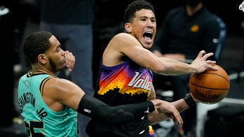 Booker's 35 points leads Suns past Hornets 101-97 in OT