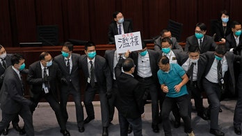 China reduces elected seats in Hong Kong legislature