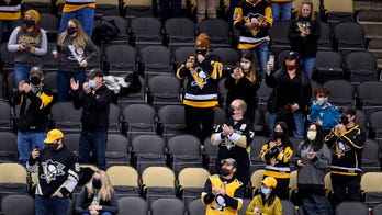 NHL team under fire for photoshopping masks on to fans in social media photo