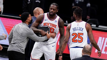 Knicks' Julius Randle restrained by teammates, taken off the court after controversial call in loss to Nets