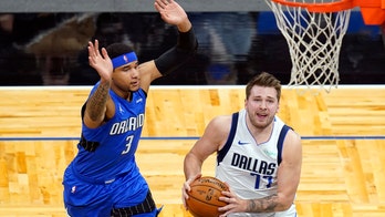 Doncic scores 33, leads Mavericks past Magic 130-124